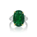 Oval Emerald with Trapezoid and Round Diamond Ring